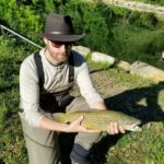 fisherman with brown trout,Mountain water adventures, fly fishing, musky fishing wv, fly fishing wv, fly fishing for musky, native trout, group trip fly fishing, trout fishing wv, musky on a fly, rainbow trout wv, spring fed fly fishing streams, brown trout wv, golden trout wv, certified fishing guide, certified fishing guide wv, wv, west Virginia, private water fly fishing, west Virginia fly fishing, private fly fishing, private land fly fishing, Monroe County WV, Greenbrier County WV, stream restoration, restored fly fishing stream, Greenbrier, Greenbrier resort, White Sulphur Springs, fly casting instruction, James Crews, Clare Lyons, Second Creek, Drop Lick Creek, the New River, Lazy River, fly fishing gear