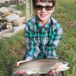 boy with trout,Mountain water adventures, fly fishing, musky fishing wv, fly fishing wv, fly fishing for musky, native trout, group trip fly fishing, trout fishing wv, musky on a fly, rainbow trout wv, spring fed fly fishing streams, brown trout wv, golden trout wv, certified fishing guide, certified fishing guide wv, wv, west Virginia, private water fly fishing, west Virginia fly fishing, private fly fishing, private land fly fishing, Monroe County WV, Greenbrier County WV, stream restoration, restored fly fishing stream, Greenbrier, Greenbrier resort, White Sulphur Springs, fly casting instruction, James Crews, Clare Lyons, Second Creek, Drop Lick Creek, the New River, Lazy River, fly fishing gear