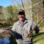 fisherman with trout,Mountain water adventures, fly fishing, musky fishing wv, fly fishing wv, fly fishing for musky, native trout, group trip fly fishing, trout fishing wv, musky on a fly, rainbow trout wv, spring fed fly fishing streams, brown trout wv, golden trout wv, certified fishing guide, certified fishing guide wv, wv, west Virginia, private water fly fishing, west Virginia fly fishing, private fly fishing, private land fly fishing, Monroe County WV, Greenbrier County WV, stream restoration, restored fly fishing stream, Greenbrier, Greenbrier resort, White Sulphur Springs, fly casting instruction, James Crews, Clare Lyons, Second Creek, Drop Lick Creek, the New River, Lazy River, fly fishing gear